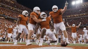 Illustrative image of adult college football players in plain burnt-orange uniforms celebrating a late touchdown in a packed stadium at night.